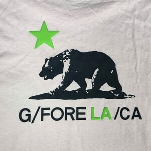G/FORE White Short Sleeve Tee with Black Bear Graphic and Neon Green Star
